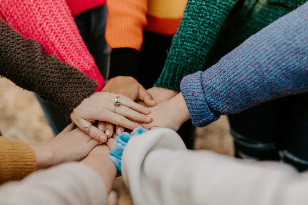 Community working together - photo by Hannah Busing on Unsplash.