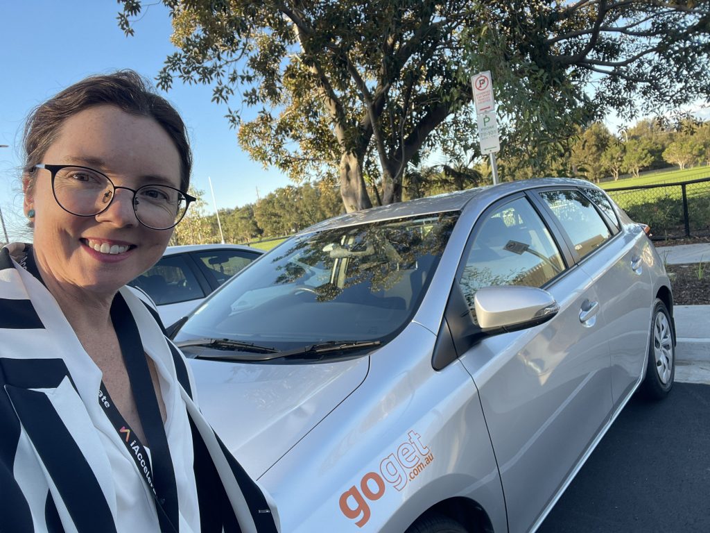 Kylie Flament with a GoGet carshare car