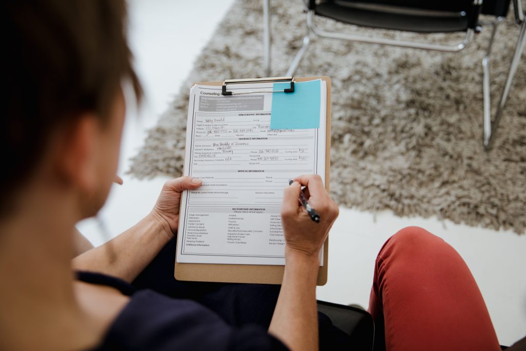 Someone filling in a paper survey