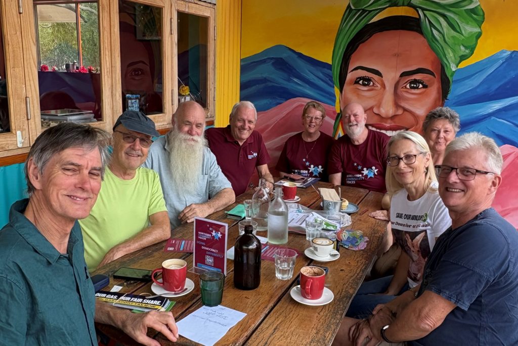 NCV volunteers talking over coffee at a local cafe