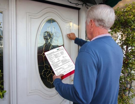 Community campaigner door knocking